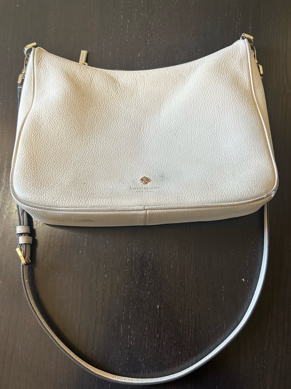 kate spade pebbled leather shoulder bag in light beige broken pipe on corner